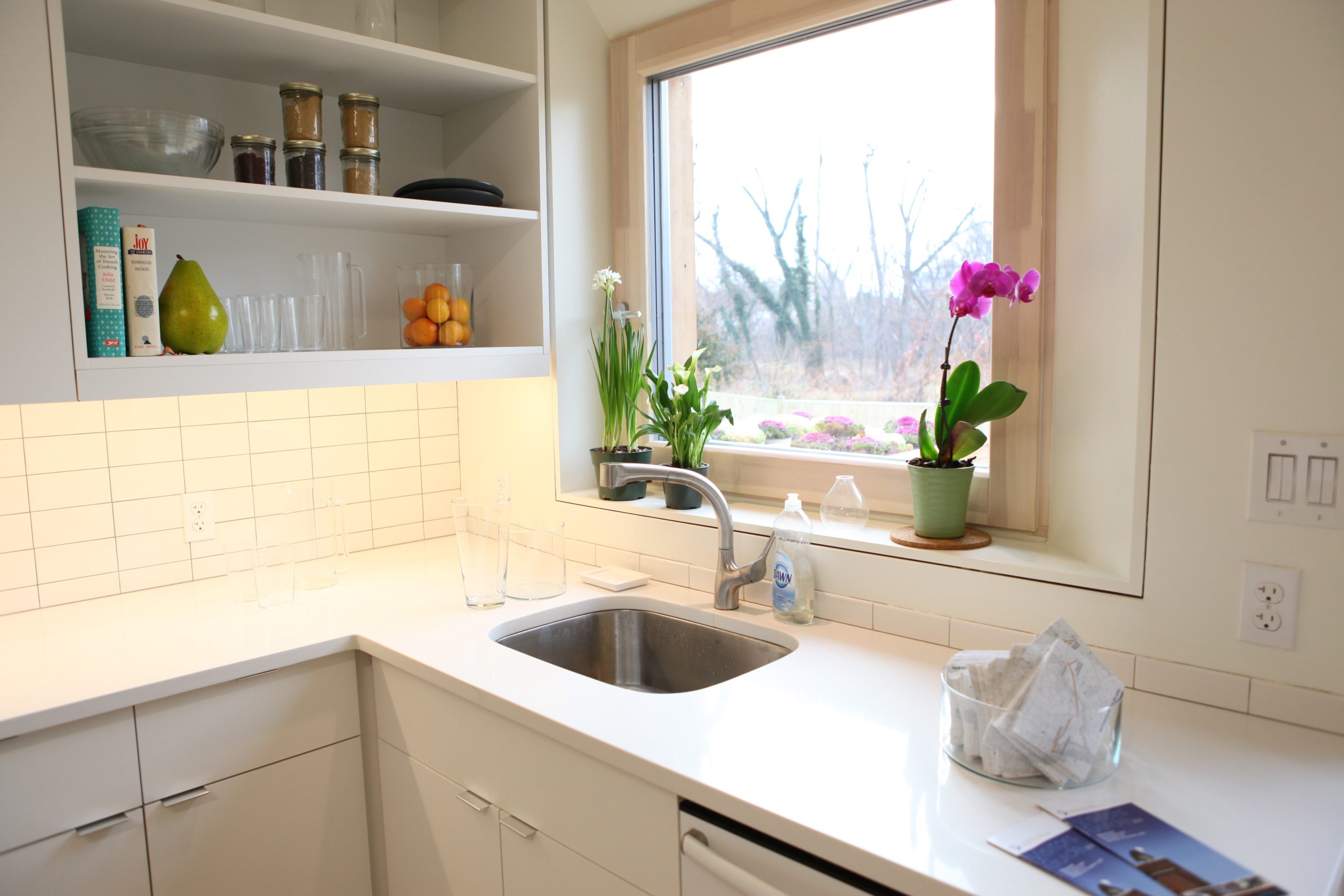 white kitchen counter with silver kitchen sink