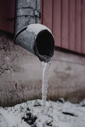pipe with frozen water dripping from it